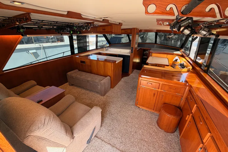 Slide: The Image of Interior of a 1982 Bertram 54 Convertible yacht with wood furnishings and seating. - 47