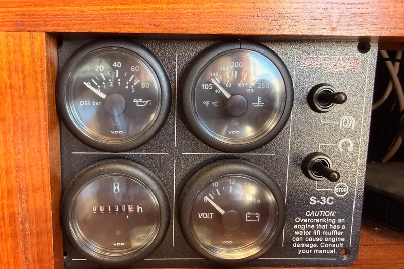 Slide: The Image of Instrument panel of a 1982 Bertram 54 Convertible boat with gauges and switches. - 101