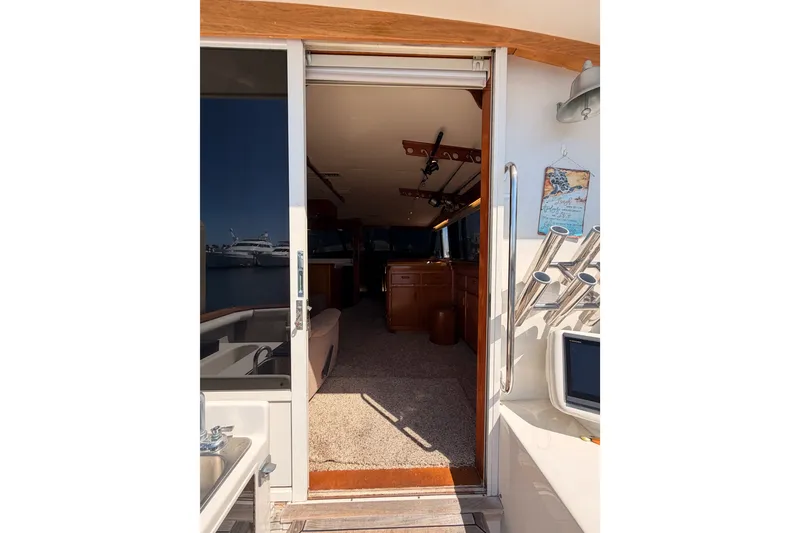 Slide: The Image of Interior view of 1982 Bertram 54 Convertible yacht, showcasing cabin entrance. - 46
