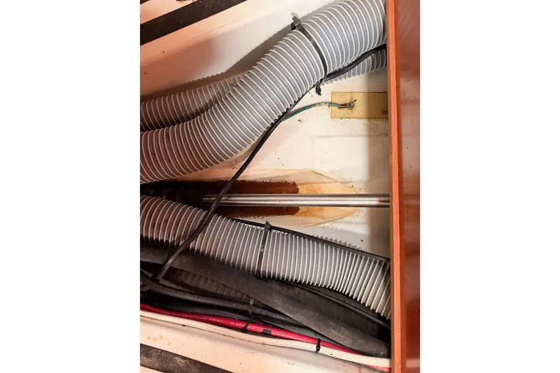 Slide: The Image of Interior view of 2008 Beneteau 49 yacht showing ventilation hoses and wiring. - 86