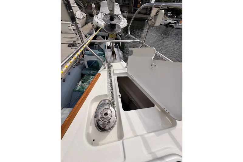 Slide: The Image of 2008 Beneteau 49 yacht deck with anchor chain and storage compartment. - 15