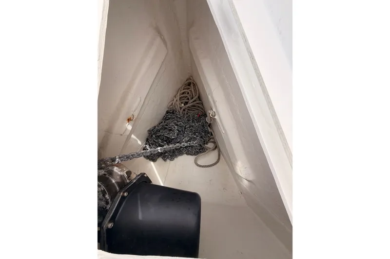 Slide: The Image of Anchor locker of a 2008 Beneteau 49 sailboat with chain and rope. - 16