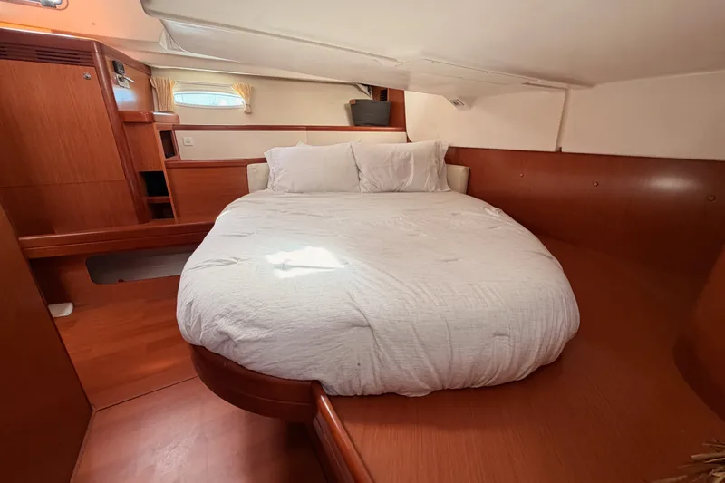 Slide: The Image of Luxurious cabin interior of a 2008 Beneteau 49 yacht with a cozy bed. - 77