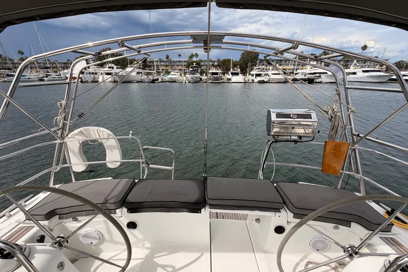 Slide: The Image of Cockpit view of a 2008 Beneteau 49 yacht in a marina setting. - 24
