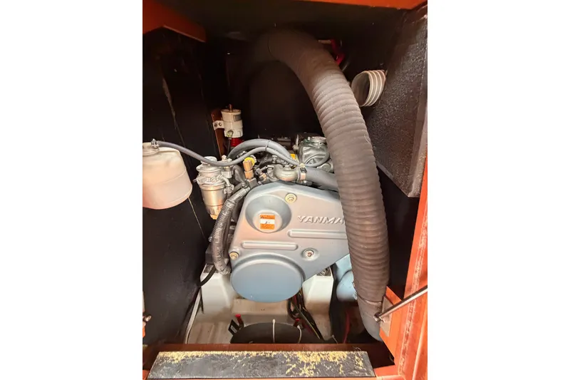 Slide: The Image of Engine compartment of a 2008 Beneteau 49 sailboat, featuring a Yanmar engine. - 81