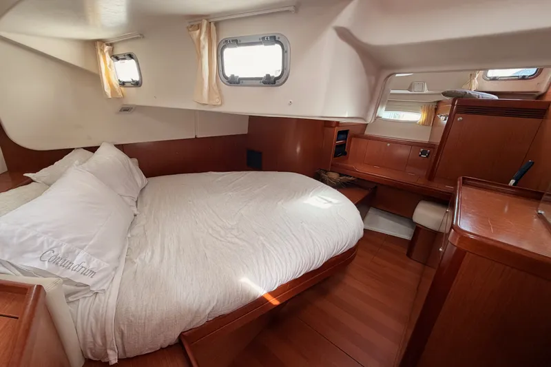 Slide: The Image of Luxurious cabin interior of a 2008 Beneteau 49 yacht with cozy bedding. - 74