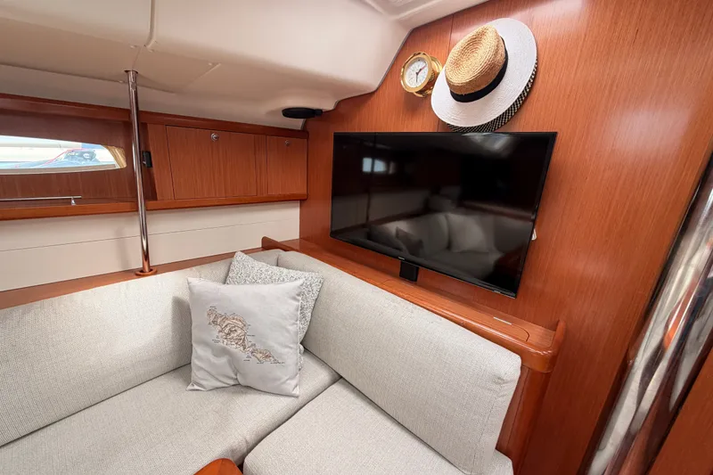 Slide: The Image of Luxurious interior of 2008 Beneteau 49 yacht with TV, clock, and stylish decor. - 62