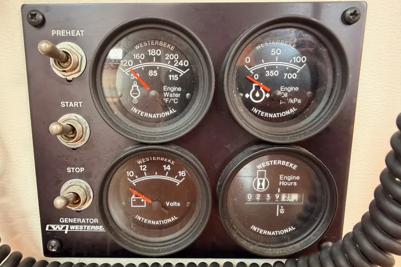 Slide: The Image of Control panel of a 2008 Beneteau 49 with Westerbeke generator gauges. - 91