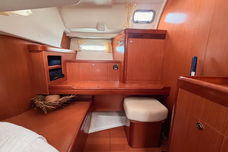 Slide: The Image of Interior of 2008 Beneteau 49 yacht with wooden cabinetry and seating. - 76