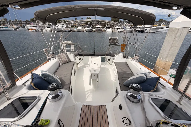 Slide: The Image of Spacious cockpit of a 2008 Beneteau 49 yacht docked at a marina. - 23