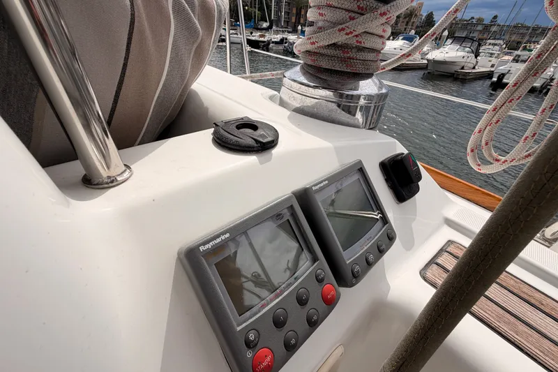 Slide: The Image of Cockpit of 2008 Beneteau 49 sailboat with navigation instruments and winch. - 32