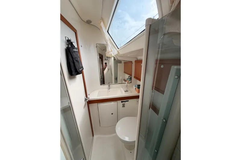 Slide: The Image of Interior view of 2008 Beneteau 49 yacht bathroom with skylight and modern fixtures. - 53