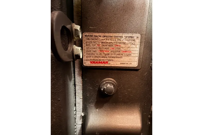 Slide: The Image of Yanmar marine engine emission control label on a 2008 Beneteau 49 sailboat. - 82