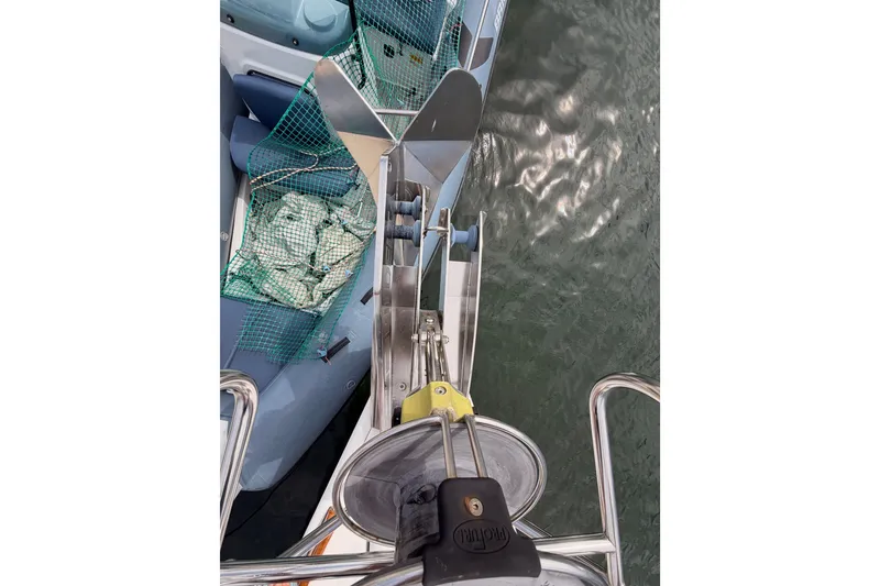 Slide: The Image of Bow view of 2008 Beneteau 49 sailboat with anchor and netting. - 17