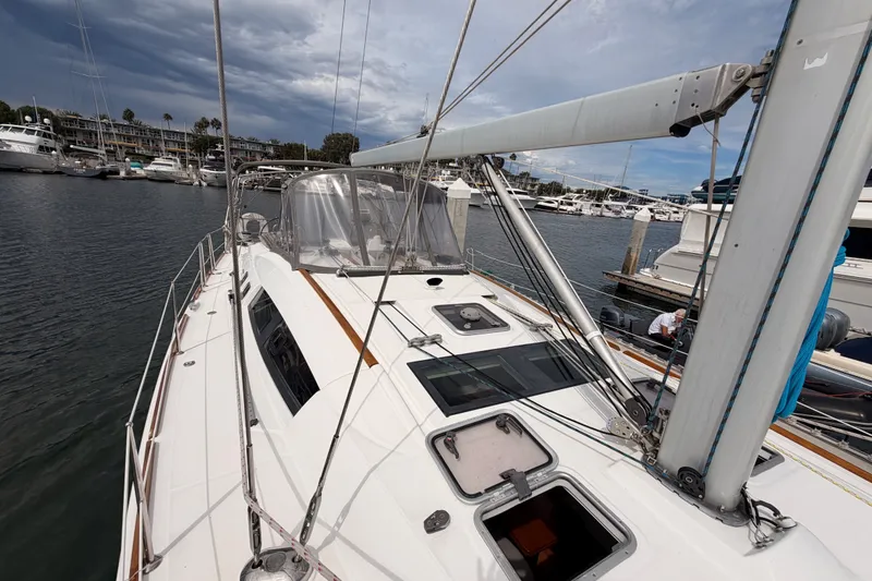 Slide: The Image of 2008 Beneteau 49 sailboat docked in a marina under cloudy skies. - 20