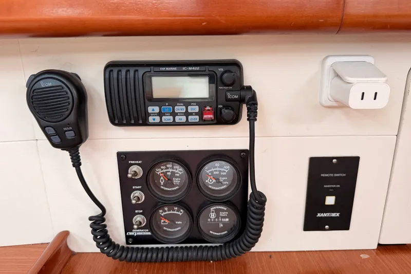 Slide: The Image of Control panel of a 2008 Beneteau 49 yacht with VHF radio and gauges. - 57