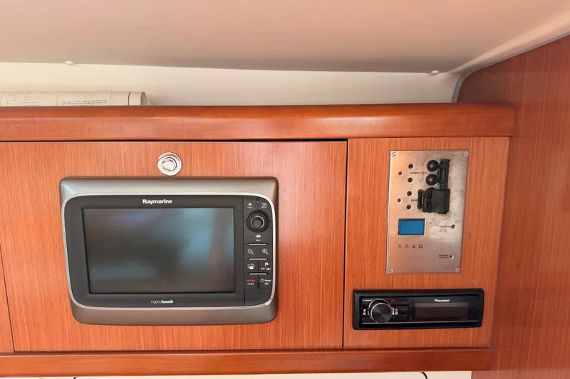 Slide: The Image of Control panel and Raymarine display on 2008 Beneteau 49 yacht interior. - 59