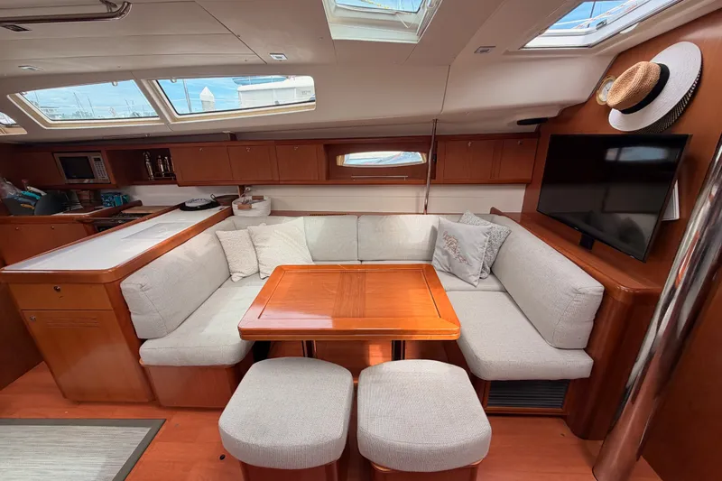 Slide: The Image of Luxurious interior of a 2008 Beneteau 49 yacht with cozy seating and modern amenities. - 61