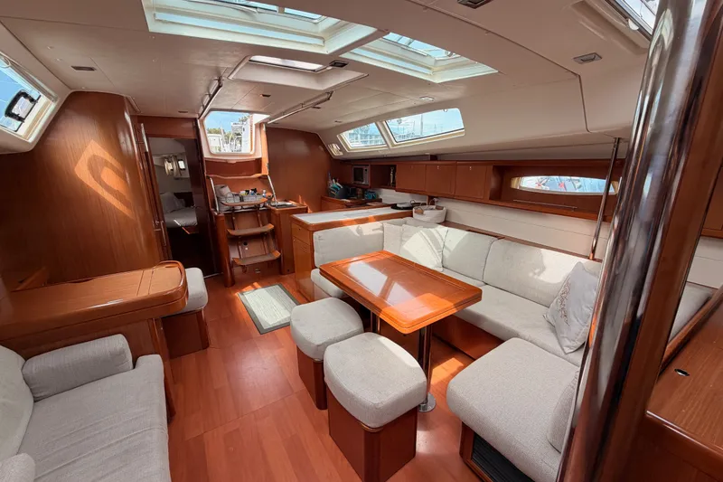 Slide: The Image of Luxurious interior of 2008 Beneteau 49 yacht with elegant wood finish and spacious seating. - 71