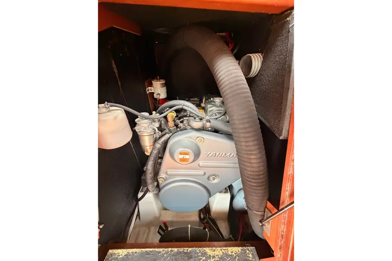 Slide: The Image of Engine compartment of a 2008 Beneteau 49 sailboat, featuring a Yanmar engine. - 80