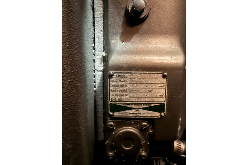 Slide: The Image of Close-up of a Yanmar diesel engine plate on a 2008 Beneteau 49 sailboat. - 83