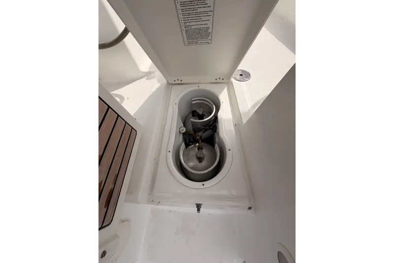 Slide: The Image of Storage compartment on a 2008 Beneteau 49 yacht, featuring gas cylinders. - 27