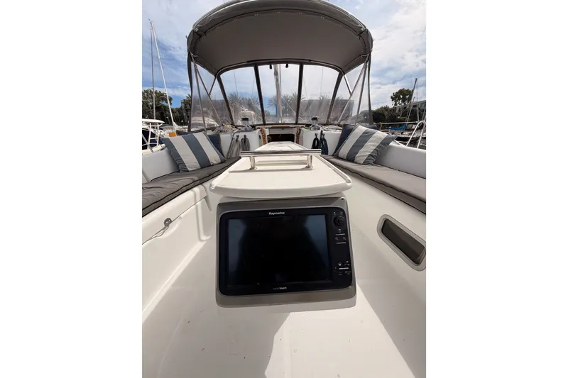 Slide: The Image of 2008 Beneteau 49 yacht cockpit with cushions and navigation equipment. - 30