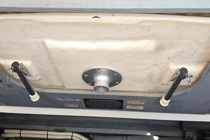 Slide: The Image of Engine compartment of a 2001 Sea Ray Sundancer 310 boat, showing mechanical components. - 37