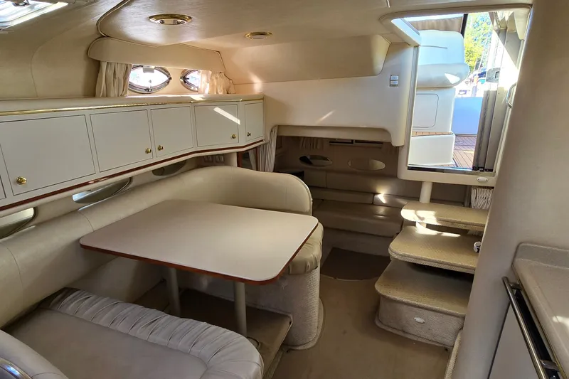 Slide: The Image of Interior of 2001 Sea Ray Sundancer 310 yacht with dining area and stairs. - 28
