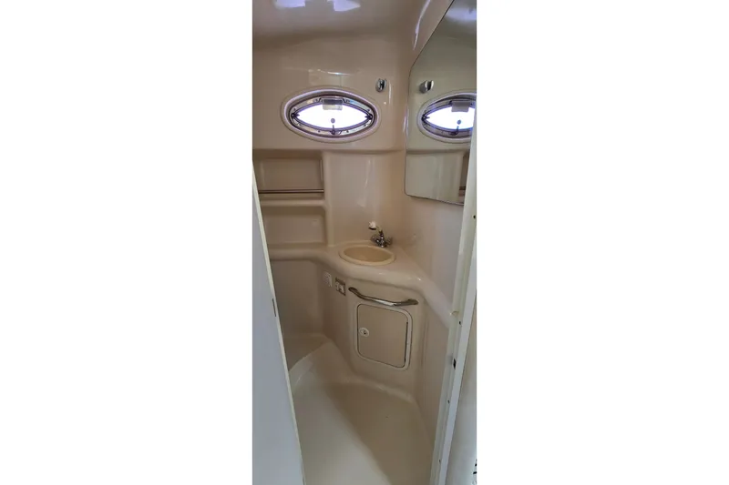Slide: The Image of Bathroom interior of 2001 Sea Ray Sundancer 310 yacht with sink and porthole window. - 30