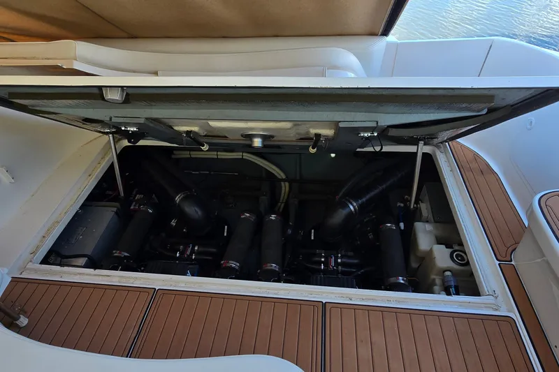 Slide: The Image of Engine compartment of a 2001 Sea Ray Sundancer 310 boat, showcasing mechanical components. - 42