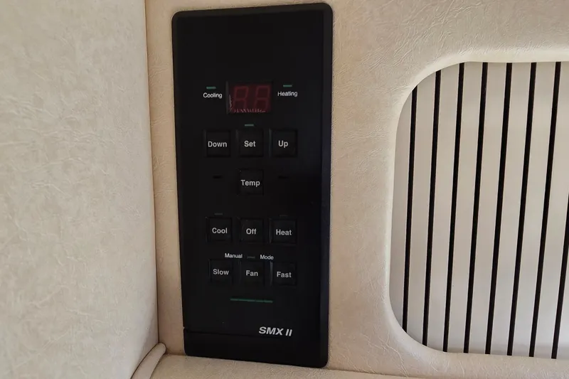 Slide: The Image of Control panel of a 2001 Sea Ray Sundancer 310 boat, featuring temperature settings. - 25