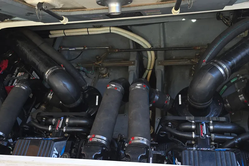 Slide: The Image of Engine compartment of a 2001 Sea Ray Sundancer 310 boat, showcasing dual engines. - 36