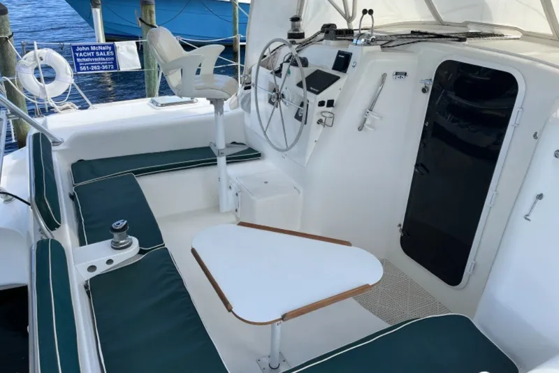 Slide: The Image of 2004 Manta 42 MkII yacht cockpit with seating, steering wheel, and navigation equipment. - 10