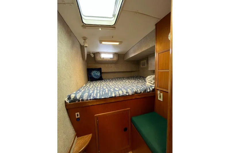 Slide: The Image of Cozy cabin interior of 2004 Manta 42 MkII sailboat with skylight and patterned bedding. - 22