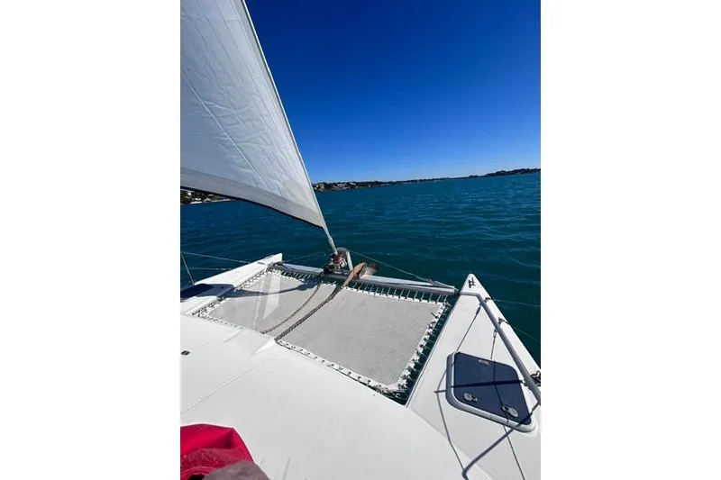 Slide: The Image of Sailing on a 2004 Manta 42 MkII catamaran in clear blue waters. - 72