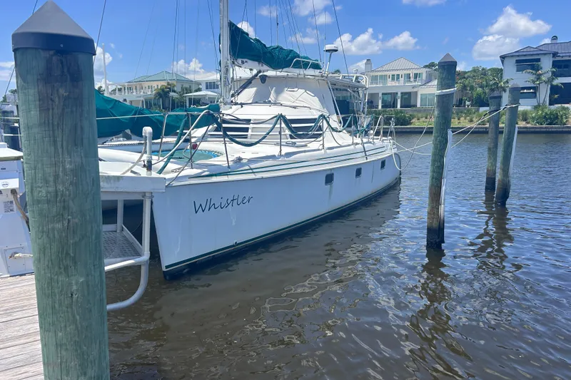 The Image of 2004 Manta 42 MkII catamaran named "Whistler" docked at a marina. - 1