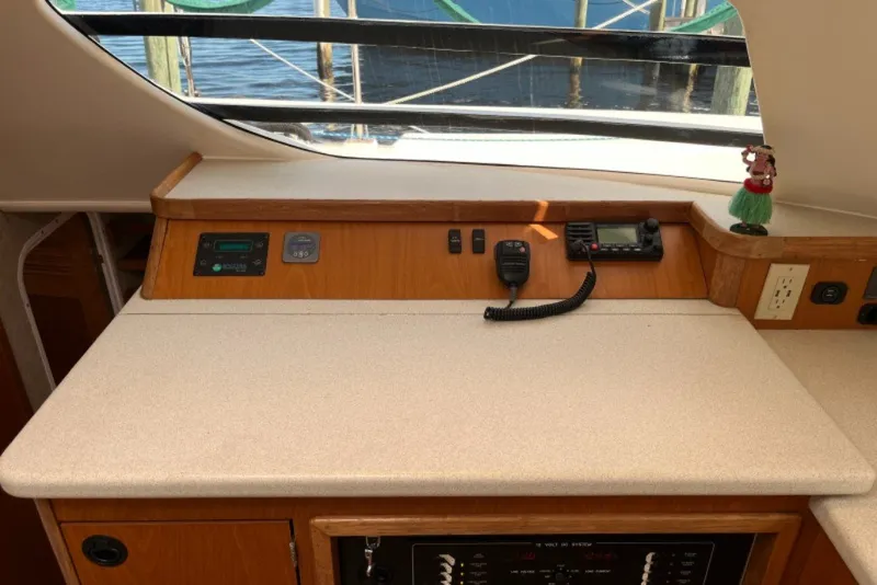 Slide: The Image of Interior view of a 2004 Manta 42 MkII yacht's navigation station with communication equipment. - 28
