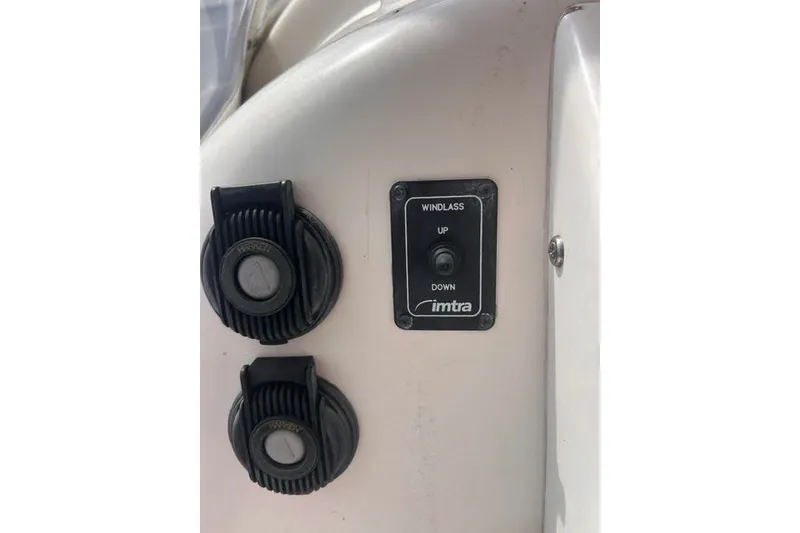Slide: The Image of Windlass control panel on 2004 Manta 42 MkII boat, featuring up and down switches. - 38