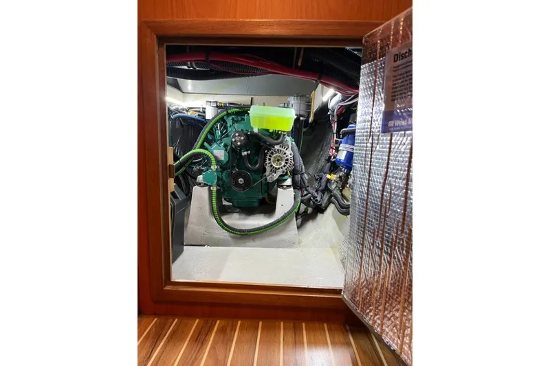 Slide: The Image of Engine compartment of a 2004 Manta 42 MkII sailboat, showcasing mechanical components. - 60