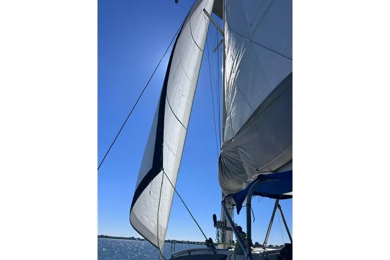 Slide: The Image of Sailing on a 2004 Manta 42 MkII catamaran under clear blue skies. - 0