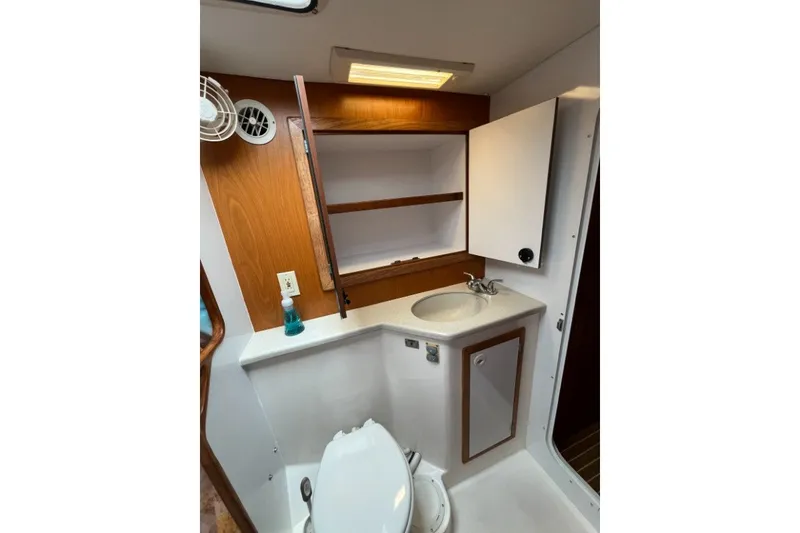Slide: The Image of Bathroom interior of 2004 Manta 42 MkII yacht with sink, cabinet, and toilet. - 36