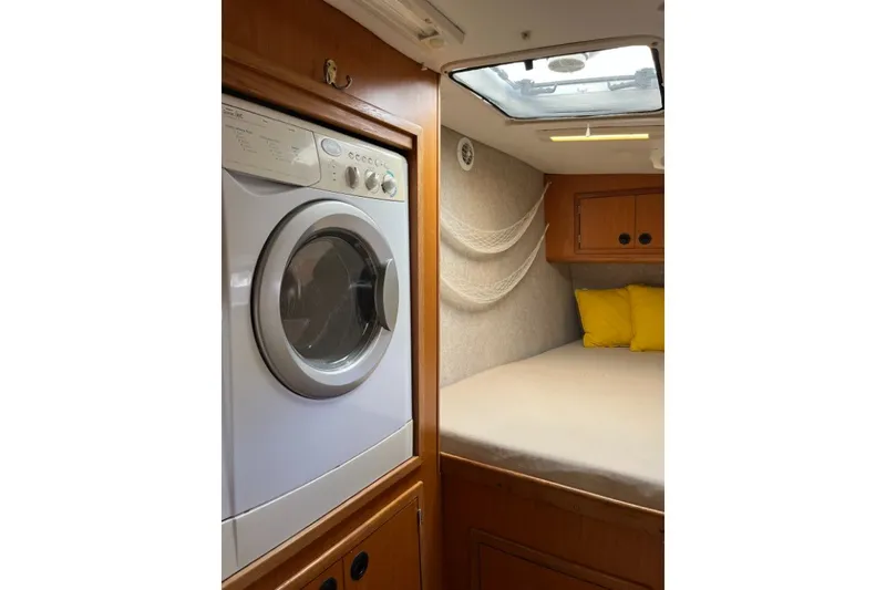 Slide: The Image of Interior of 2004 Manta 42 MkII yacht with washer and cozy bed. - 40