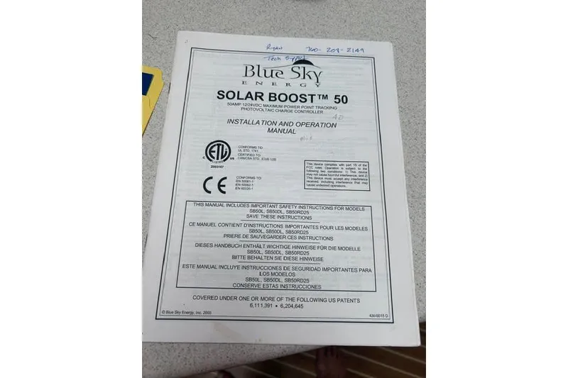 Slide: The Image of Blue Sky Energy Solar Boost 50 installation manual on a countertop, Manta 42 MkII, 2004. - 55