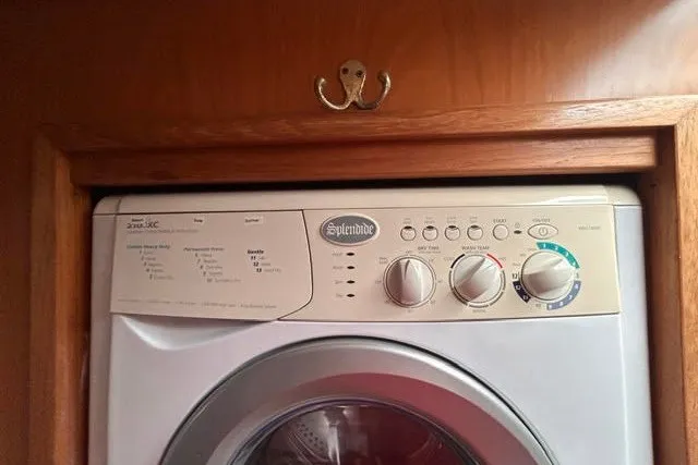 Slide: The Image of Splendide washer in 2004 Manta 42 MkII yacht, wooden cabinetry. - 33