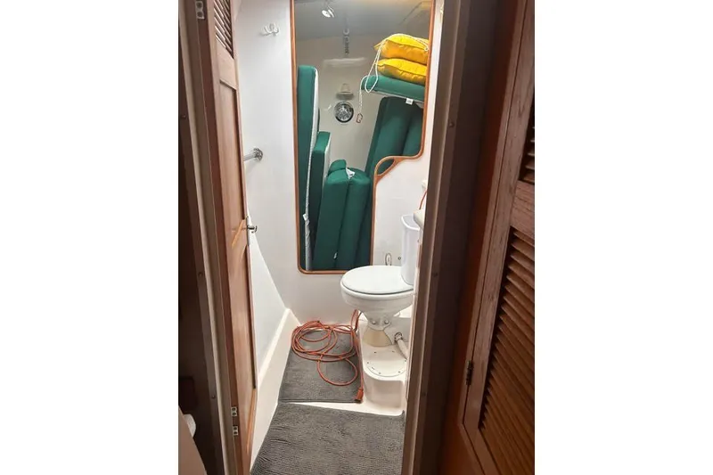 Slide: The Image of Bathroom interior of 2004 Manta 42 MkII yacht with toilet and storage. - 16