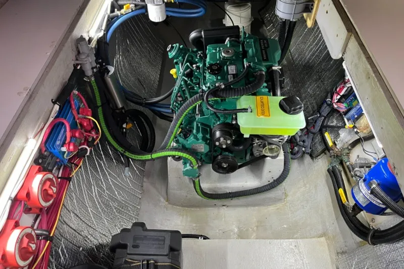 Slide: The Image of Engine compartment of a 2004 Manta 42 MkII sailboat, showcasing detailed wiring and components. - 59