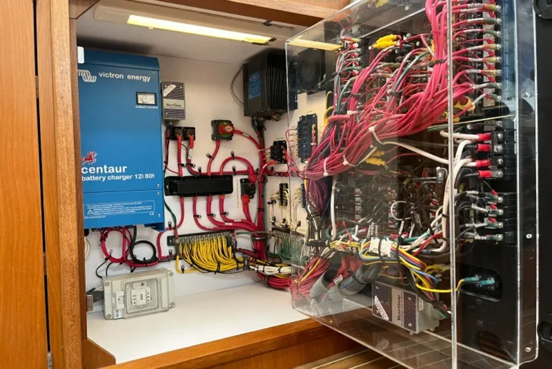 Slide: The Image of Electrical panel of a 2004 Manta 42 MkII with Victron Energy battery charger. - 55
