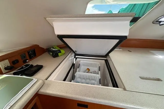 Slide: The Image of Interior of 2004 Manta 42 MkII yacht with open countertop storage. - 14