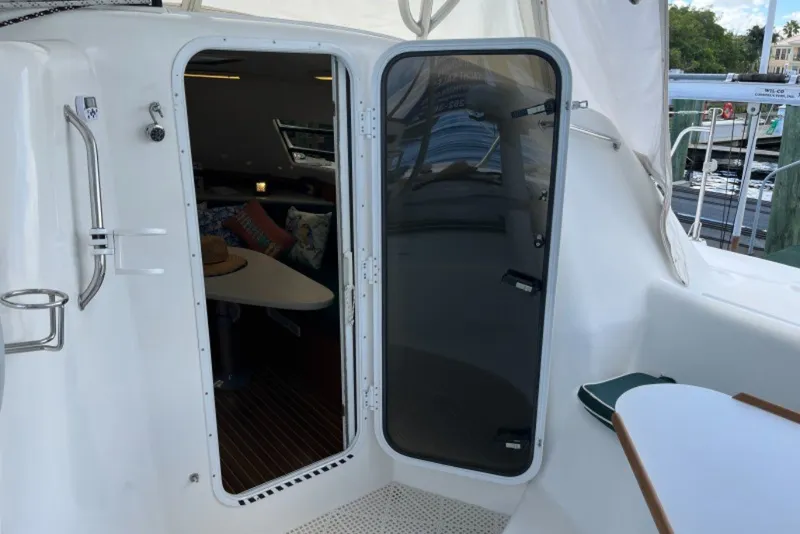 Slide: The Image of Cabin entrance of 2004 Manta 42 MkII catamaran with interior view. - 11